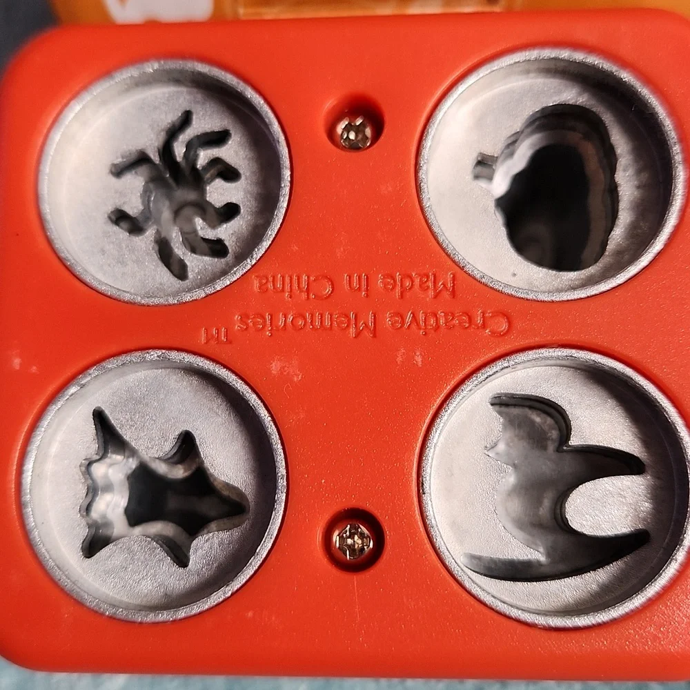 Creative Memories Halloween Micro Maker and 10 sheets of black 8x8 cardstock.